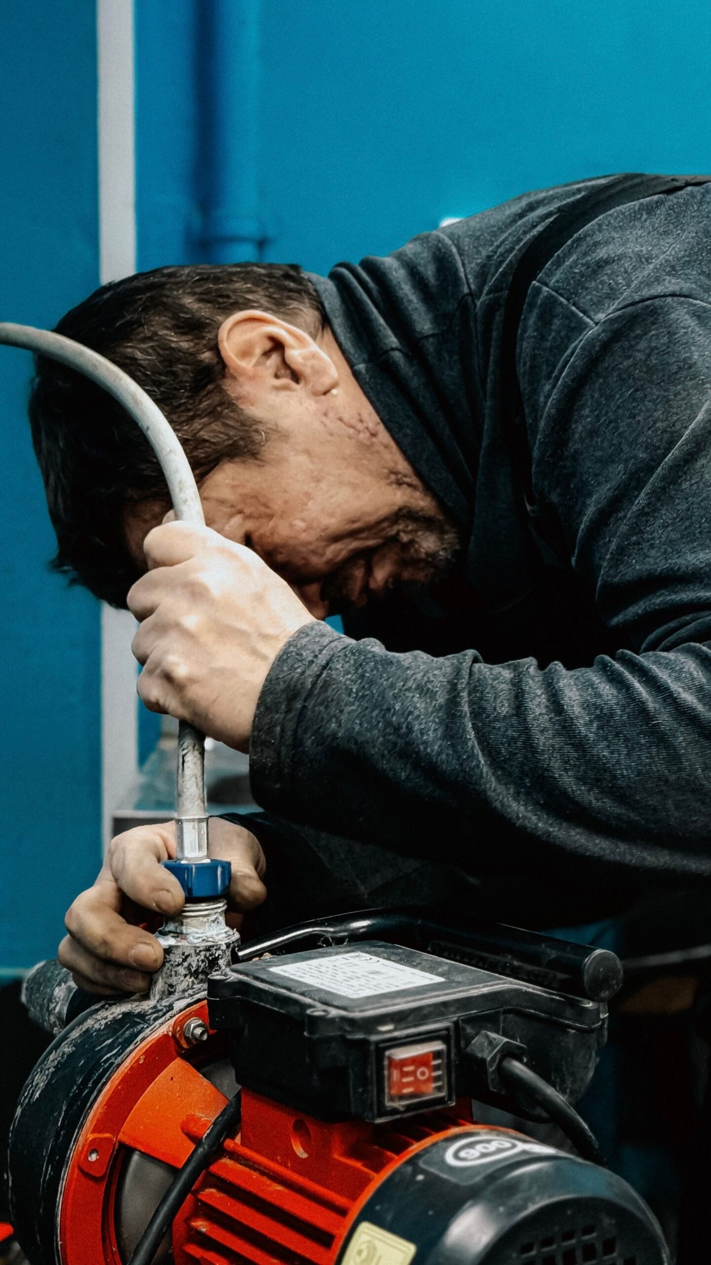 Plumber urgently servicing a water pump system, Las Vegas NV